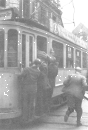 EU/D/NRW/HA/Hagen/Kampstrasse/194(7)xxxx_D_NRW_HA_Kampstrasse_Kreuzung_ElberfelderStrasse_Strassenbahn_Linie_9_(LoettgersReimann1989S26or)